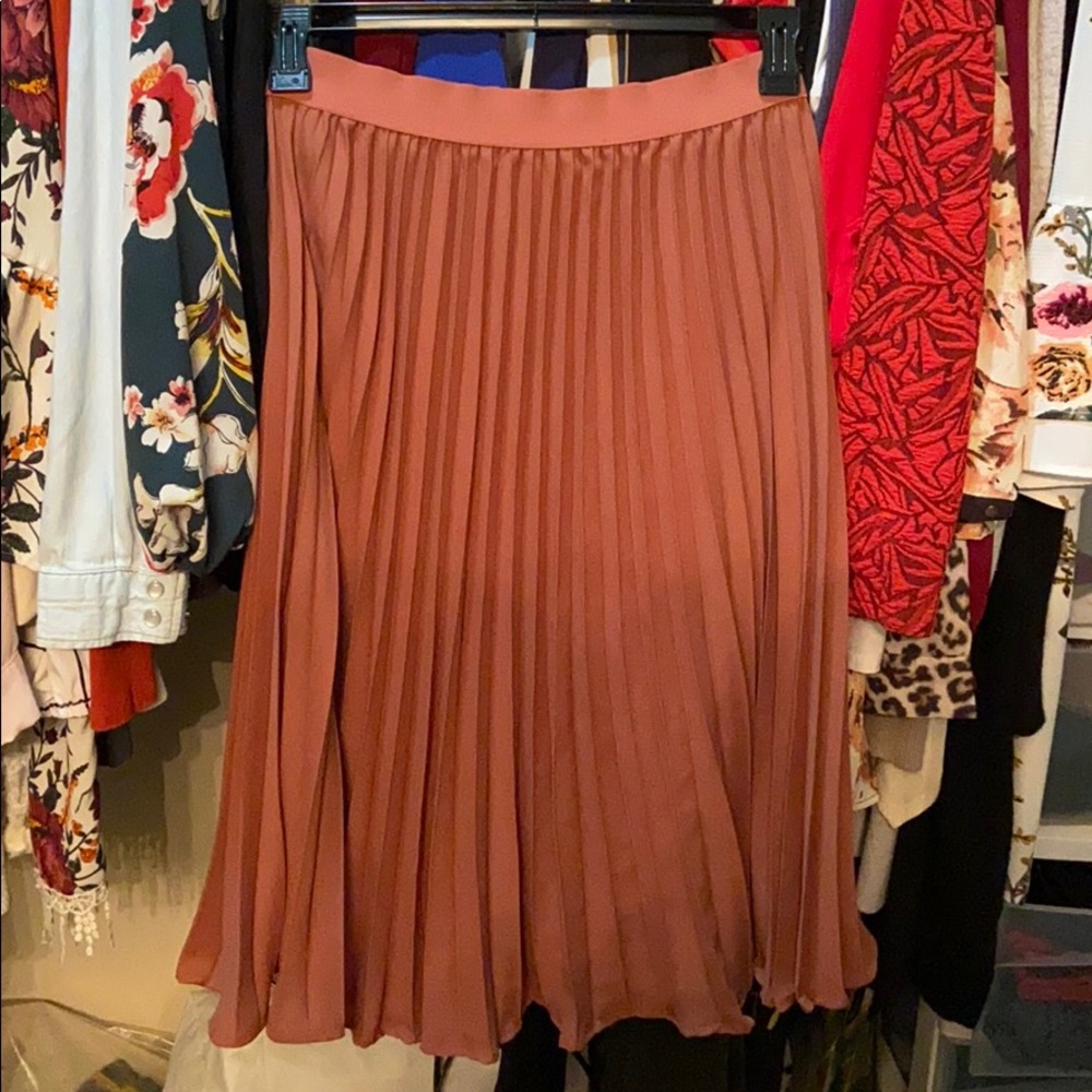 Pleated orange skirt